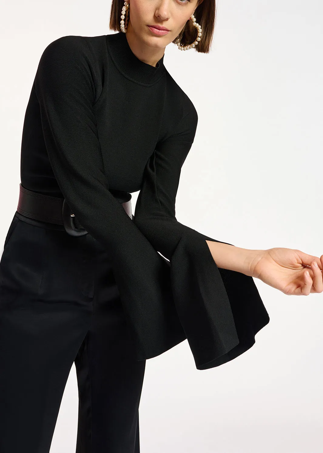 Black slim-fit knit sweater with trumpet sleeves
