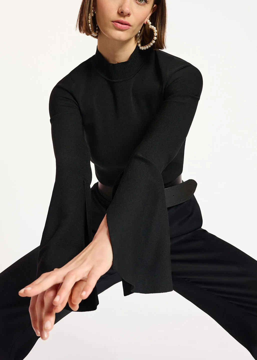 Black slim-fit knit sweater with trumpet sleeves